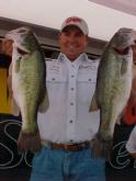 Pro Mark Goines of Shady Point, Okla., holds up his winning stringer to the crowd. Goines used a 14-pound, 12-ounce catch to capture first place in the EverStart tour event on Sam Rayburn.
