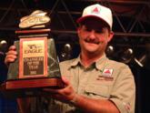 Wesley Burnett poses for photographers as he holds up his 2001 Eagle Co-Angler of the Year trophy.