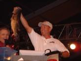 Co-angler winner Greg Lineberry hoists the biggest bass from his final-round bag.