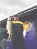 Pro John Hertensteiner of Victoria, Minn., shows off part of his 23-pound, 1-ounce catch. Hertensteiner ultimately finished the tournament in third place and won a check for $20,000.