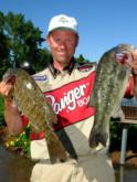 Day one at Lake Champlain was the heaviest day on record for the FLW Tour. Anglers caught many, many smallmouths and largemouths - as shown by fifth-place pro Jim Moynagh here, who holds one of each.