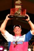 John Sappington of Wyandotte, Okla., holds up his first-place trophy after defeating Gerald Swindle in the finals of the 2002 FLW Championship.