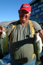 Sporting his trademark yellow ruler suspenders, co-angler Ron Chambers of Phoenix, Ariz., used a two-day catch of 10 pounds to grab the top qualifying position heading into tomorrow