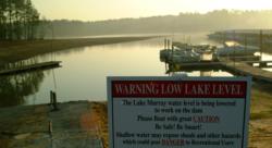 A sign at Lighthouse Marina warns boaters about low water levels on Lake Murray.
