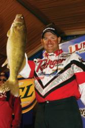 Jason Przekurat hoists a large walleye at the 2003 RCL Tour Walleye Championship.