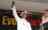 Second-place Ronald Mueller of Prosperity, S.C., takes a swipe at co-angler leader Jeff Carman with his kicker fish.
