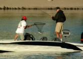 Co-angler leader George Diller, fishing the canal at Lake Havasu City, lands a keeper bass in Thursday