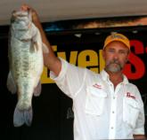 Co-angler Roger Phillips of Delta, Ala., shows off his 8-pound, 9-ounce Santee Cooper behemoth that took big-bass honors in the Co-angler Division. Phillips is in second after day one with 14 pounds, 9 ounces.