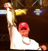 Co-angler Stephen Tosh Jr. of Waterford, Calif., weighs in one of the fish that contributed to his $20,000 win on Kentucky Lake.
