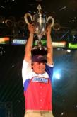 Luke Clausen hoists the 2004 Wal-Mart FLW Tour Championship trophy.