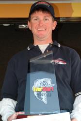 Pro Allan Glasgow proudly displays his first-place trophy after winning the EverStart event on Santee Cooper.