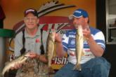 Robert Crow and Kenneth Brenner hold up three Bull Shoals walleyes.