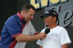 Tournament director Chris Jones thumps Thanh Le