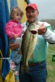 No. 3 pro Darrel Robertson holds up a fish and his granddaughter, Lexie.
