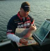 Mark Courts takes one last peek into his tackle box before the action begins on day four.