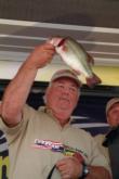 Kentucky Lake co-angler winner Chuck Rounds puts a bass on the scales.