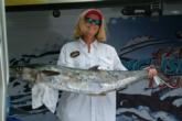 The namesake of team Barbra Ann - Barbra Adcox - holds up the 29-pound, 1-ounce king mackerel that landed them in fifth on day one.
