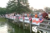 A large crowd gathers around the dock to watch the championship competitors take off on day two.