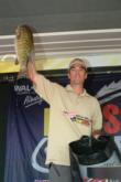 Co-angler Mark Myers of Minneapolis, Minn., weighs in his tournament-winning fish.
