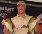 No. 3 co-angler Dave Goodwin displays a pair of bass from his five-bass stringer that weighed 12-11.