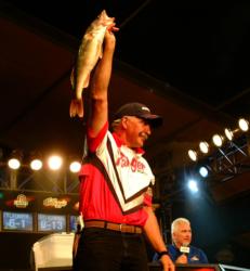 Robert Lampman hoists his kicker walleye that earned him first place and a check for $125,000 at the 2005 Wal-Mart FLW Walleye Tour Championship.