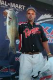 Chad Griffin holds up a 7-pound, 3-ounce bass that propelled him to third place on the pro side.