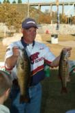 Pro Jerry Green of Justiceburg, Texas, shows off a couple of the fish from his 14-pound, 10-ounce creel, which put him in second with a two-day total of 26 pounds, 12 ounces.