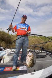 Tylenol Rapid Release pro Gabe Bolivar of Ramona, Calif., nets a nice bass in tall grass; 2006 marks his first year competing on the FLW Tour.