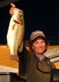 Judy Israel of Clewiston, Fla., leads the Co-angler Division with four bass weighing 13 pounds, 13 ounces, including this lunker bass weighing 6 pounds.