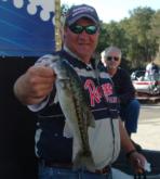 Todd Lowe holds up his 1-pound, 9-ounce bass.