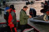 Pro Andy Coffman and co-angler Shane Logan make final preparations before takeoff Wednesday morning.