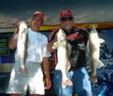Pro Pete Harsh and co-angler Jim Fetzik show off their huge day-one catch on Devils Lake. Each angler leads their respective divisions with a five-walleye total of 29 pounds, 5 ounces.