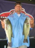 TBF Kansas President Jason Baird holds up two out of his five-fish limit.