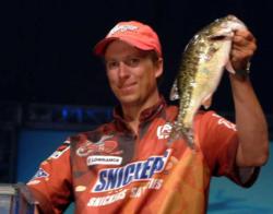 Brent Ehrler shows off a bass from his tournament-winning catch of 15 pounds, 1 ounce.
