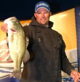 Pro Bobby Lane of Lakeland, Fla., shows off the 5-1/2 pound bass that put him in the cut on day two.