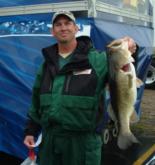 Fourth-place co-angler Joe Partain shows off an 8-pounder that he caught on the second to last cast of the day.