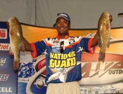 Pro leader Derek Jones holds up two giant smallmouth bass caught during Friday