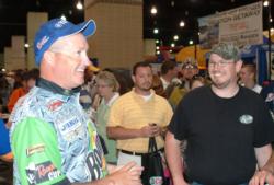 Local pro Craig Powers speaks with a throng of Knoxville fishing fans.