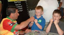 Vic Vatalaro teaches children in the Family Fun Zone how to customize jigs.
