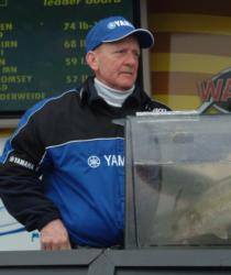 Co-angler champion Don Cozzie nervously awaits the outcome of the final weigh-in.