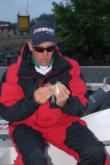 Bobby Curtis ties on a spinnerbait before day-two takeoff