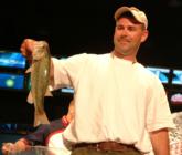 No. 3 co-angler Stacy Metz holds up the biggest bass from his day-one catch of 3 pounds, 1 ounce.