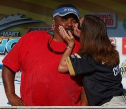 Shannon Rowland of Team Miss Micki 2 gives a kiss to James Hammonds of Team Play N