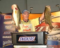 Pro Sandy Melvin holds up part of his day-two stringer from the Potomac River. 