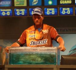 Pro leader Chris Baumgardner drops a 16-pound, 7-ounce limit on the scale.