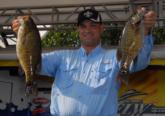 Charles Dubroc shows off two of his winning fish from day two.