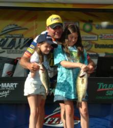 Pro Bill Spence poses with his two girls, Brooke and Meghan, at the day-four weigh-in.