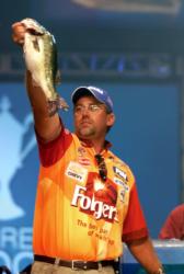 Folgers pro Scott Suggs weighs a fish during the Forrest Wood Cup finale.