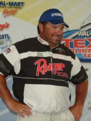 Pro leader David Curtis smiles after placing his 28-pound limit on the scale.