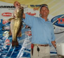 Second-place co-angler Mark Oakley holds up a 10-pound, 12-ounce bass.